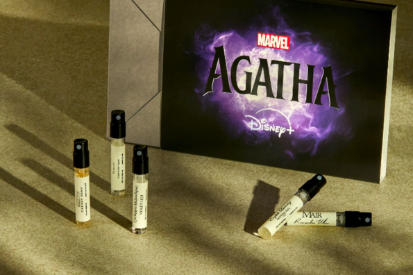 Marvel and Scentbird Marvel's Agatha Disney+ show promotional box with perfume sample vials, set against a textured green background.