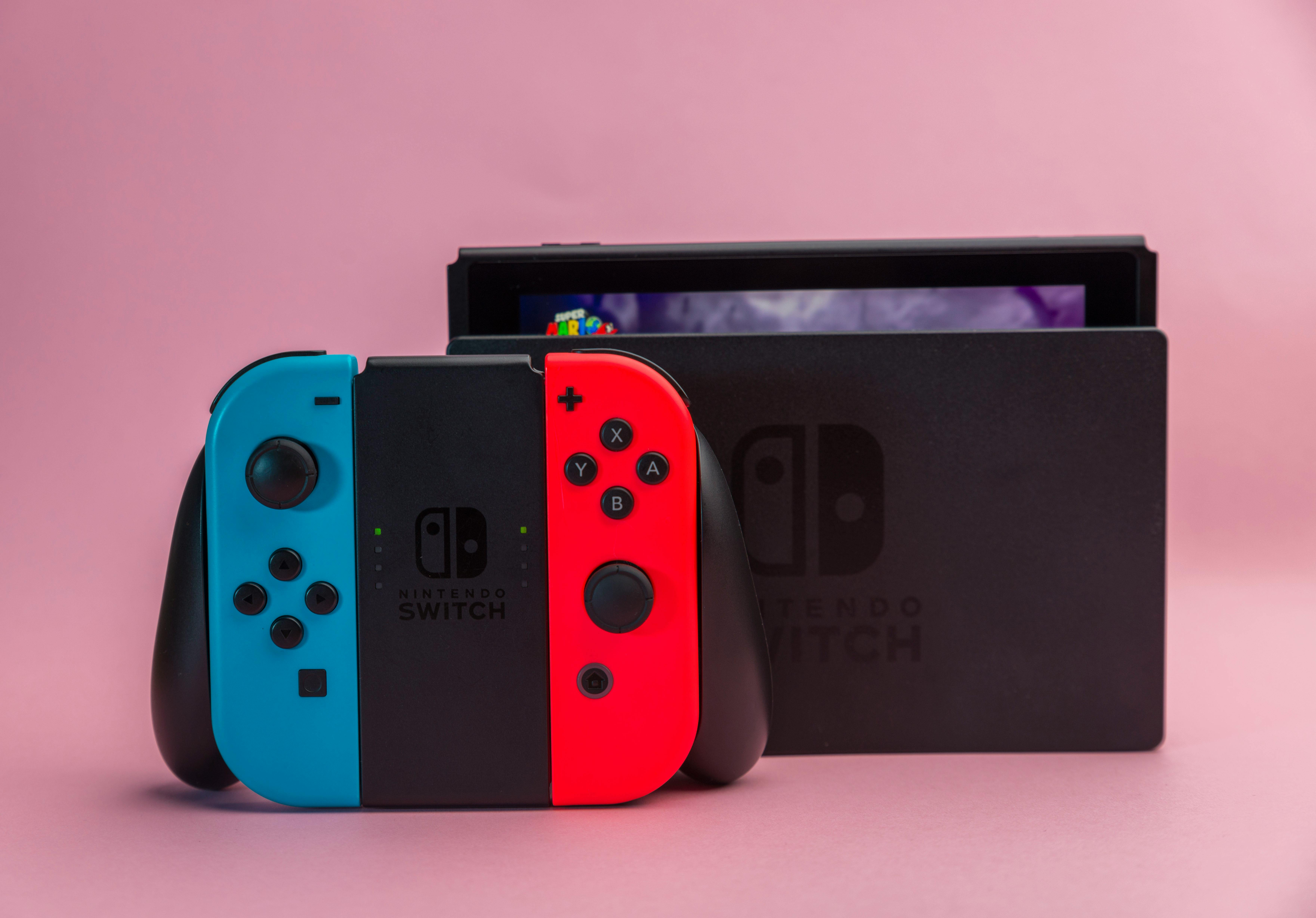 Gaming hardware: Nintendo Switch gaming console with signature controllers in brand colors