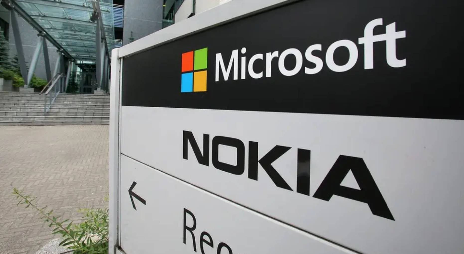 Microsoft and Nokia logo signs outside a building