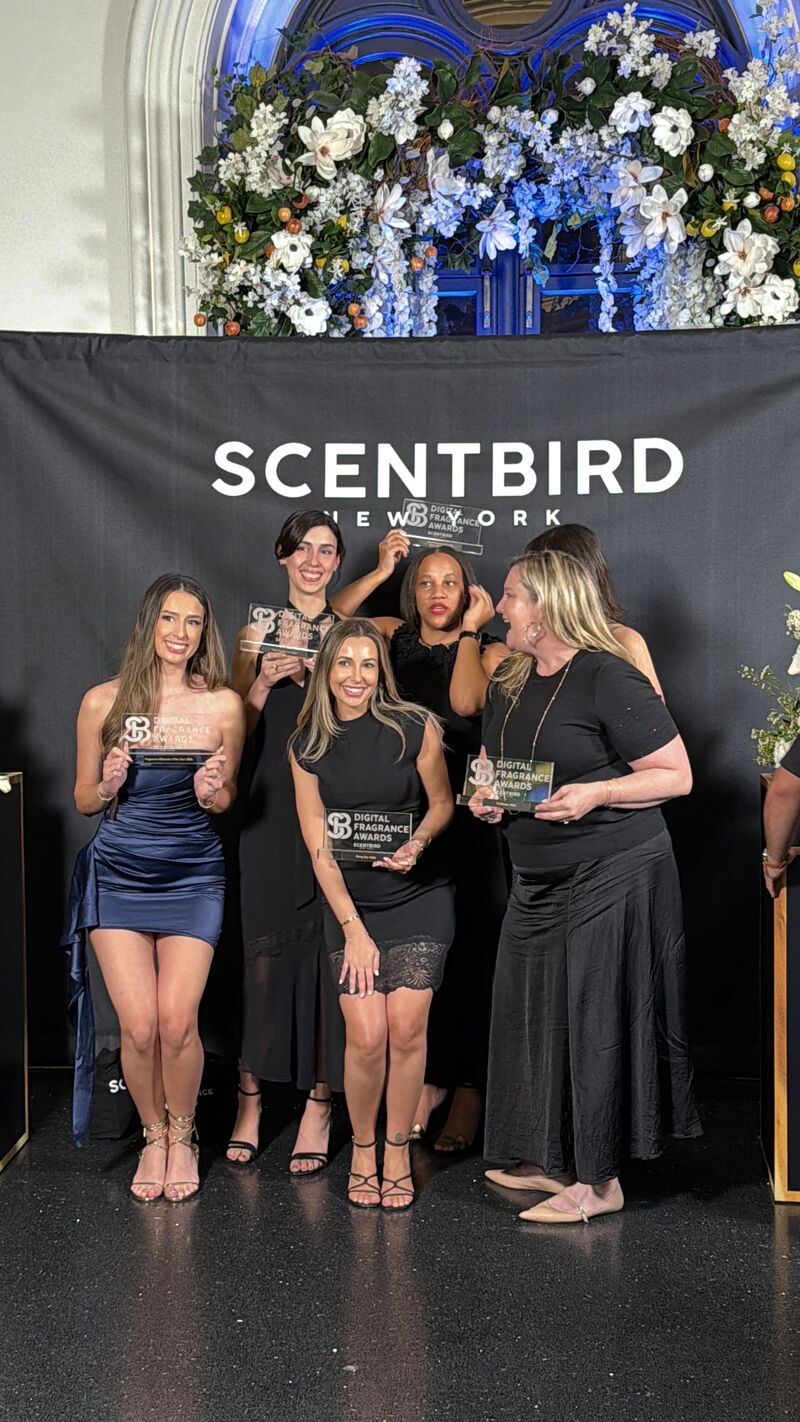 Award winners posing together with trophies at the Scentbird Digital Fragrance Awards in front of a branded backdrop.